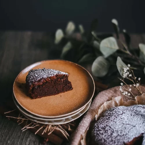 chocolate brownie cake with icing sugar