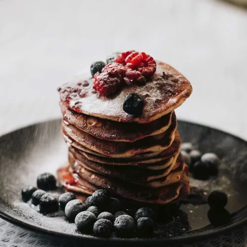 stack of pancakes with berries