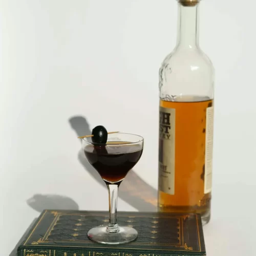 whiskey bottle and cocktail glass