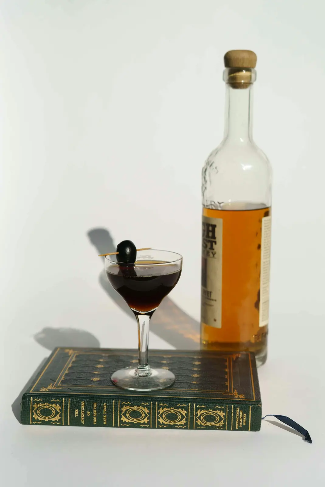 whiskey bottle and cocktail glass