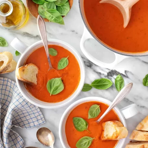 bowls of creamy tomato basil soup